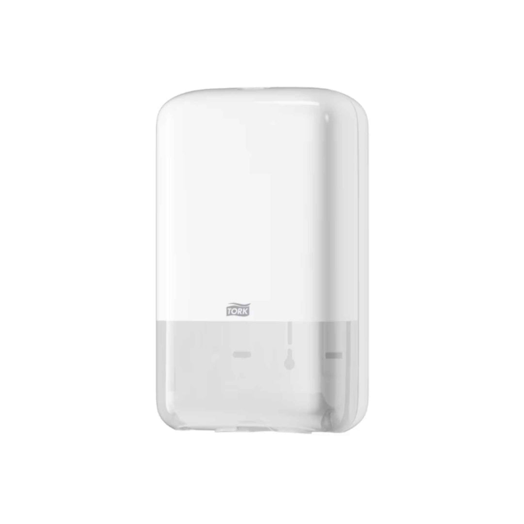 Tork 556000 T3 toiletpapirdispenser i hvid med et‑ad‑gangen funktion, hygiejnisk design, kompakt format og nem genopfyldning.